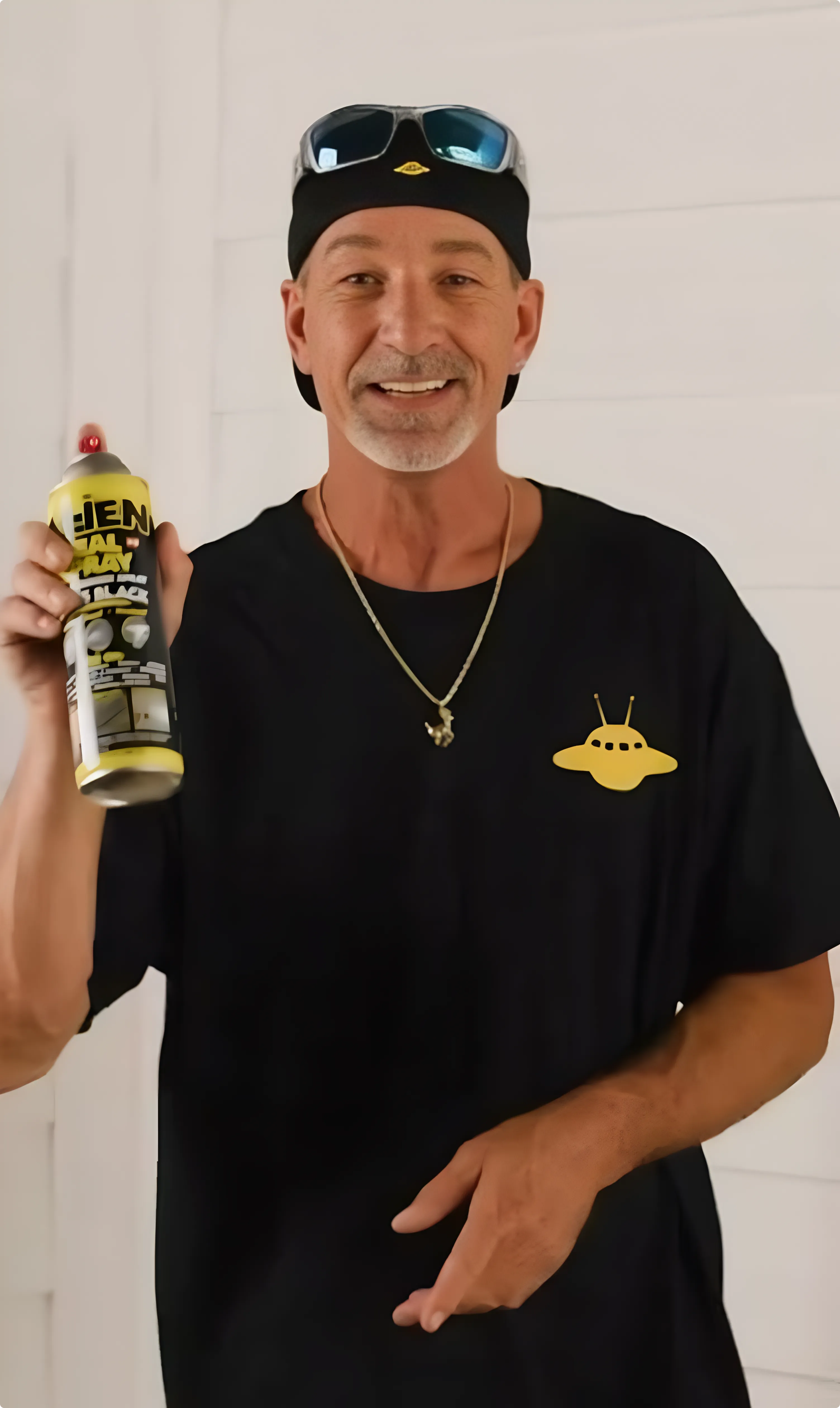 person using Alien spray sealant